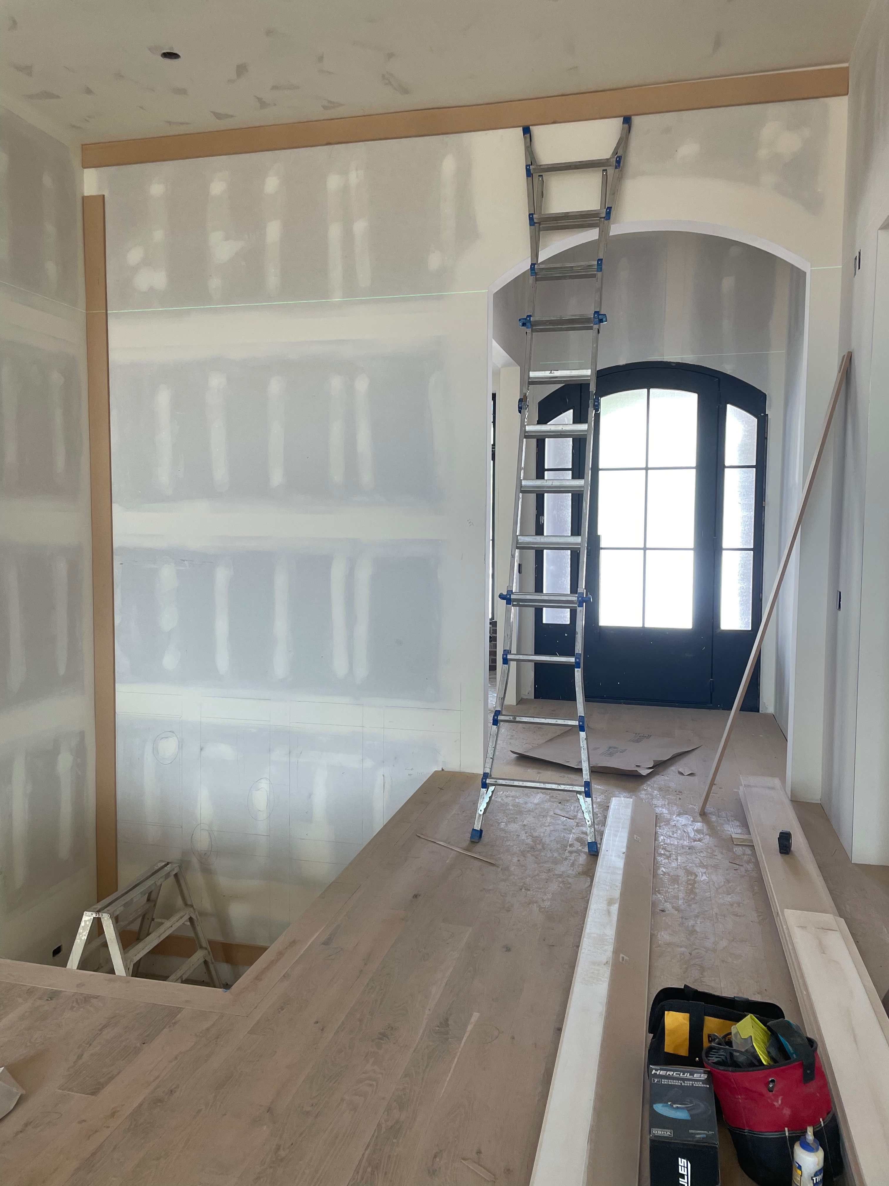 Accent wall before custom millwork by Pine River Construction