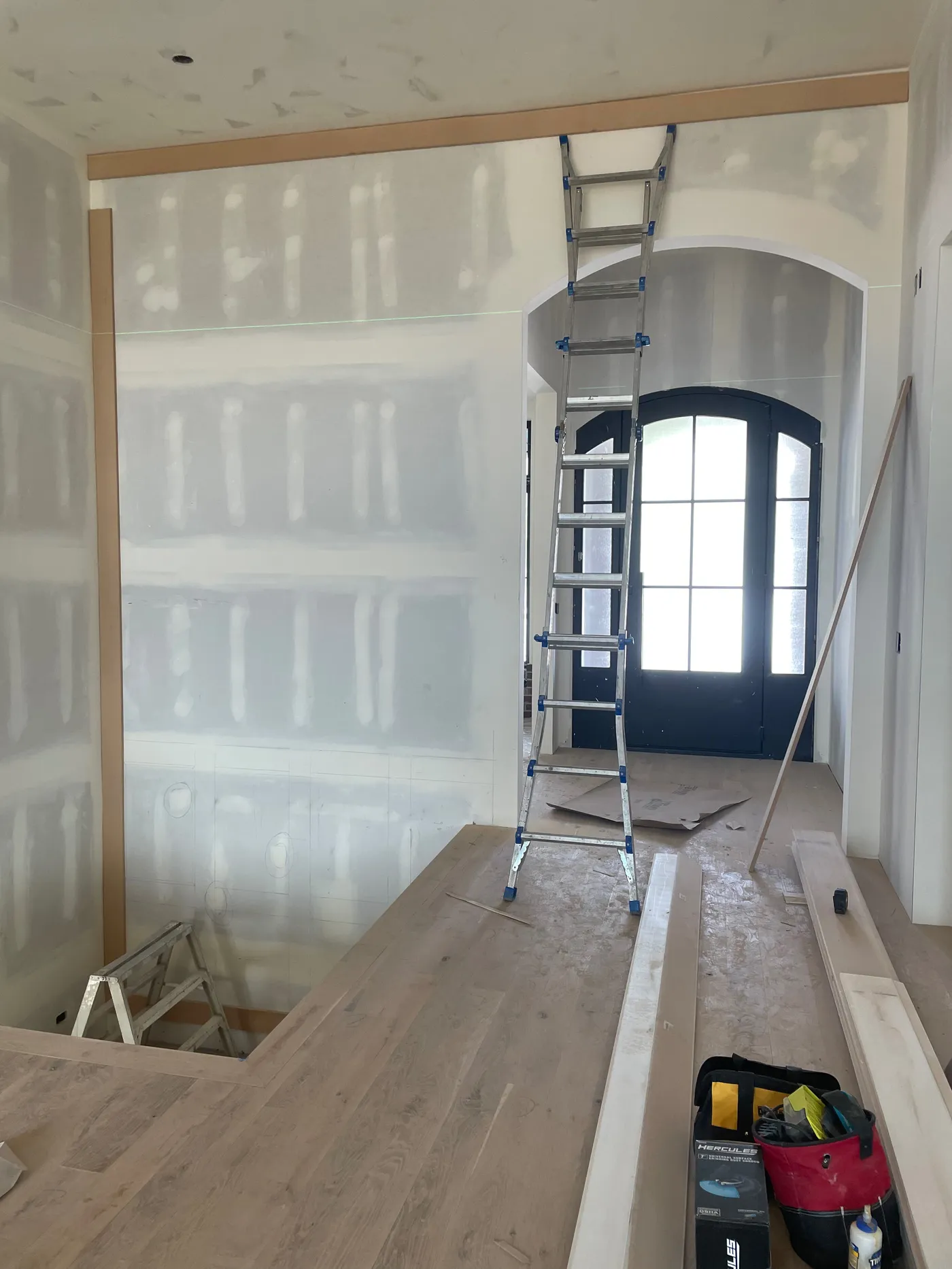 Accent wall before custom millwork by Pine River Construction