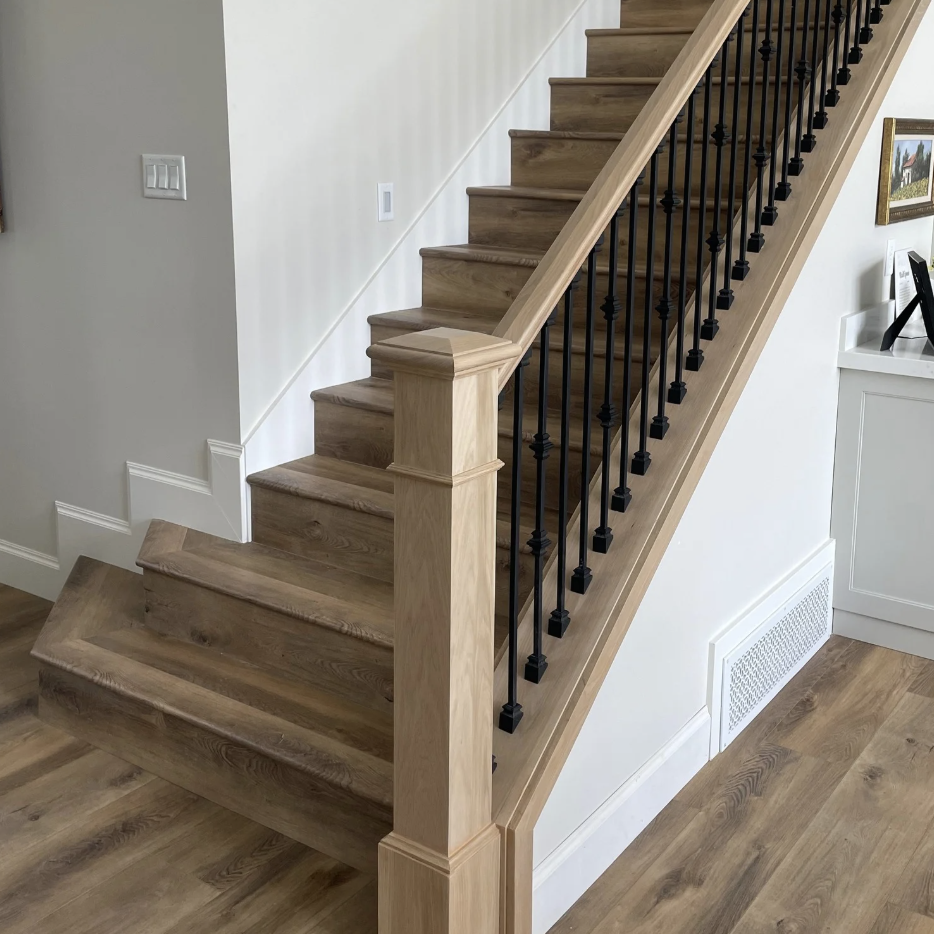 Light hardwood staircase installation by Pine River Construction — Utah